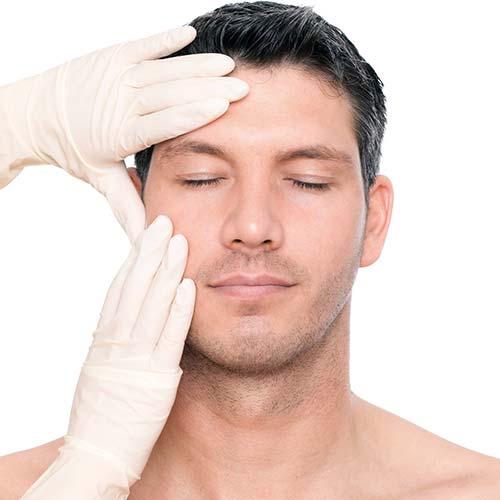 A man with his eyes closed and hands on the face.